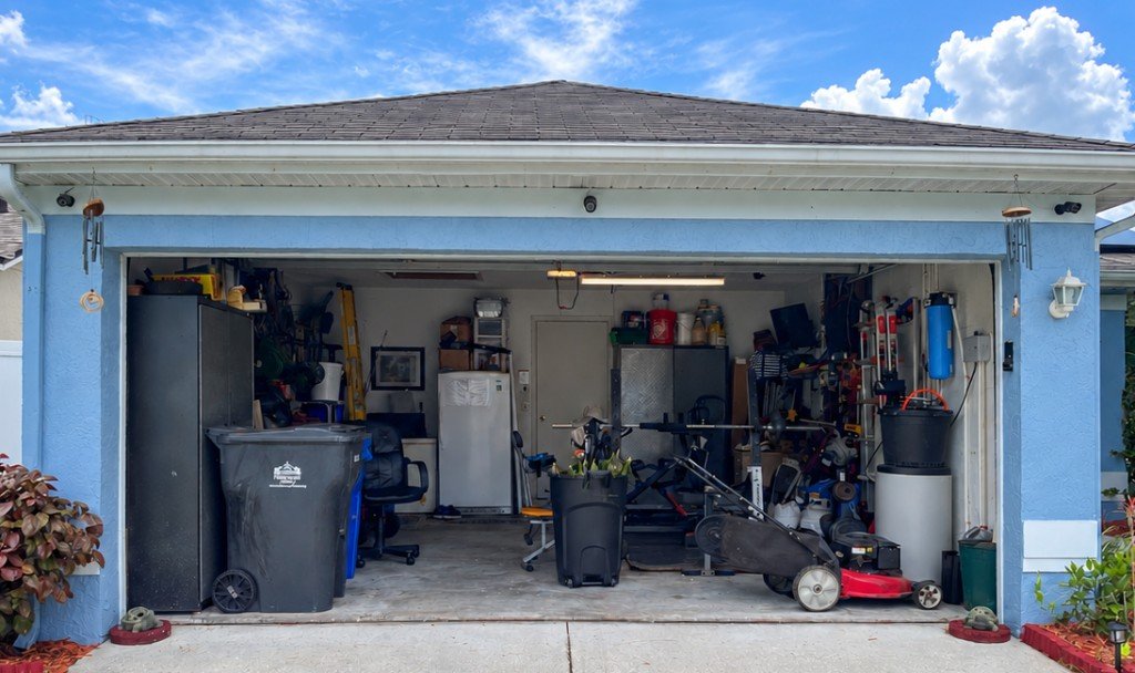 Cluttered garage before RESET